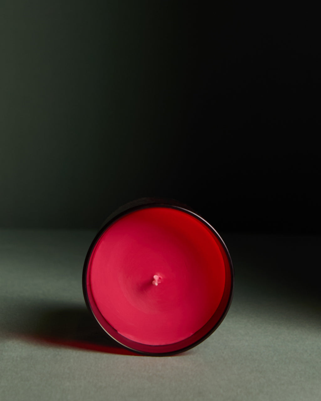 Red candle on a dark background